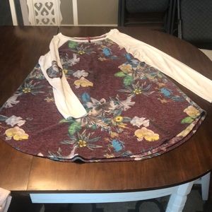 Floral top with white long sleeves with elbow patch detail.